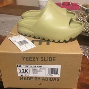 Kids 12k worn couple of times yeezy slides .